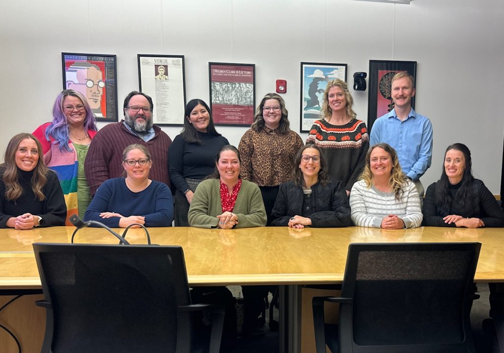 Photograph of teachers and facilitators woh participated in the 2025 AI Open Institute, taken in a classroom at BYU